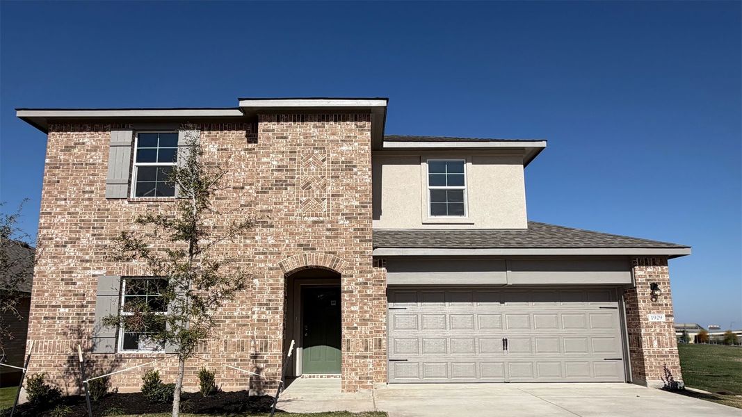 Front exterior of a new home in Rosenbusch Ranch, Leander, TX, highlighting curb appeal (Image 1). Front exterior of a new home in Rosenbusch Ranch, Leander, TX, highlighting curb appeal (Image 1).