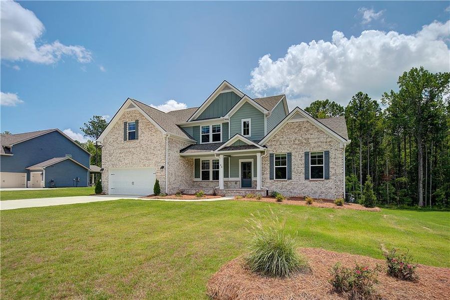 Front exterior of a new home in Saddleridge, Senoia, GA, highlighting curb appeal (Image 2).