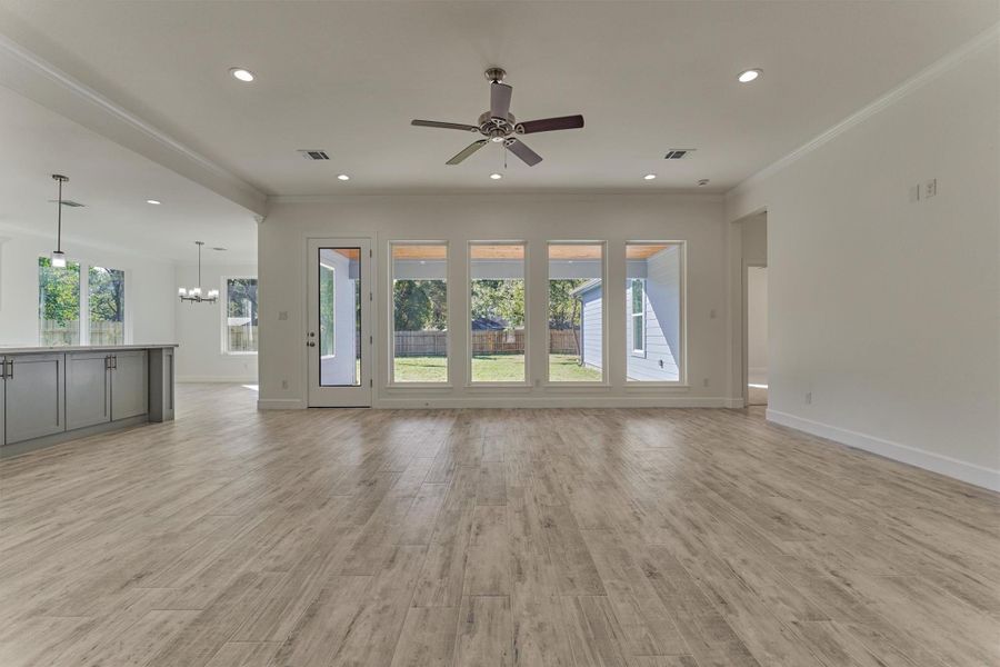 This tremendous open floor plan is bathed in natural lighting with expansive windows bringing the outside in and seamlessly blending the living areas. This tremendous open floor plan is bathed in natural lighting with expansive windows bringing the outside in and seamlessly blending the living areas.