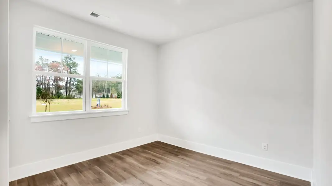 Representative unfurnished interior of a home built from the Claiborne by D.R. Horton in The Highlands at Cedar Hill Landing, Navassa (Image 21).