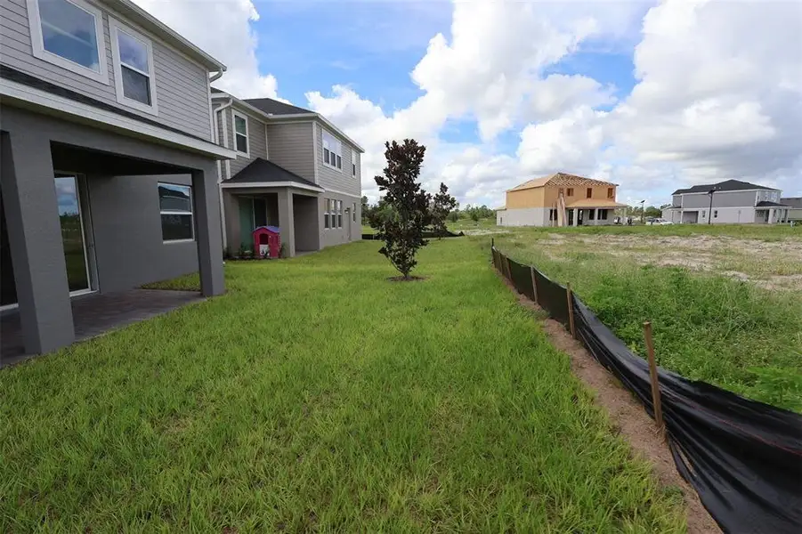 Exterior details and patio area of a home in Bay Lake Farms, St. Cloud (Image 3).