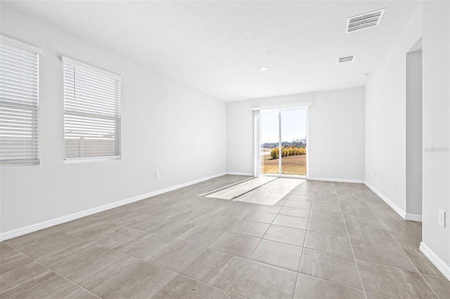 Spacious, unfurnished interior of a new home in The Grove at Stuart Crossing - Premier Series, Bartow (Image 22).