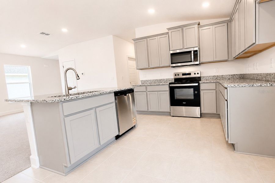 Furnished interior view inside a new home in Harmony Central, St. Cloud (Image 9).