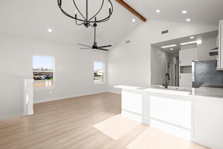 Unfurnished living room featuring recessed lighting, light wood-style floors, and a ceiling fan