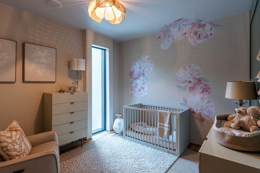 Currently a nursery, this space can be converted to a bedroom, office or hidden media room.