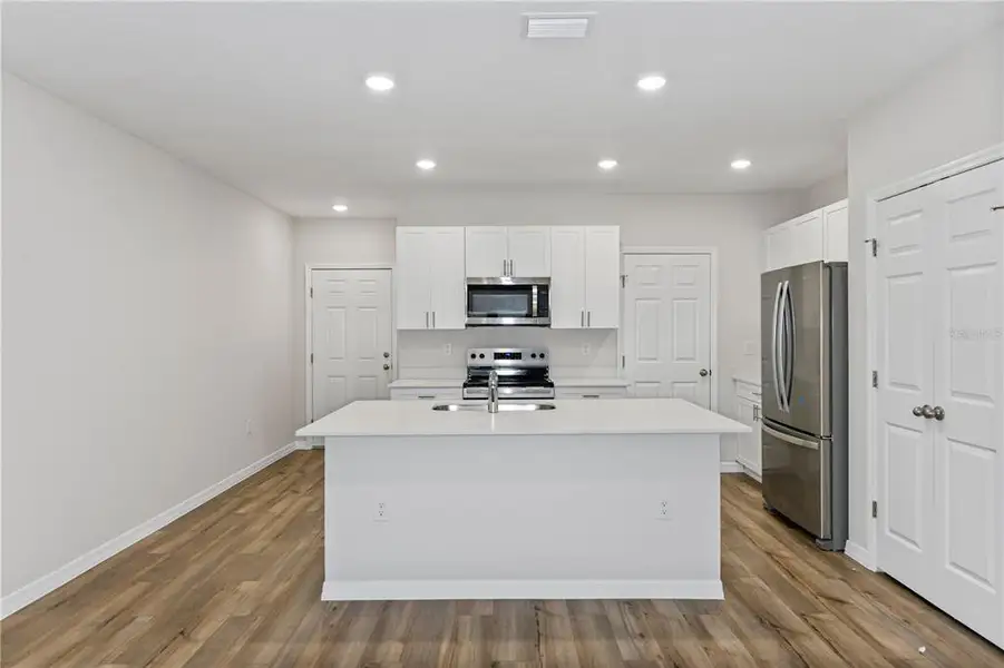 Furnished interior view inside a new home in Pasadena Woods, Dade City (Image 4).
