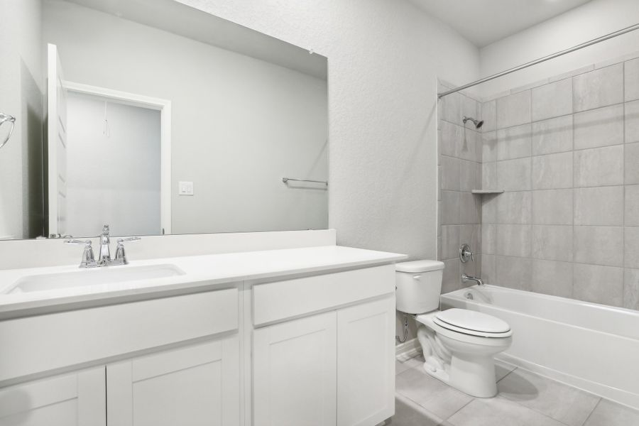 Guest bathroom in the Oleander floorplan at a Meritage Homes community. Guest bathroom in the Oleander floorplan at a Meritage Homes community.