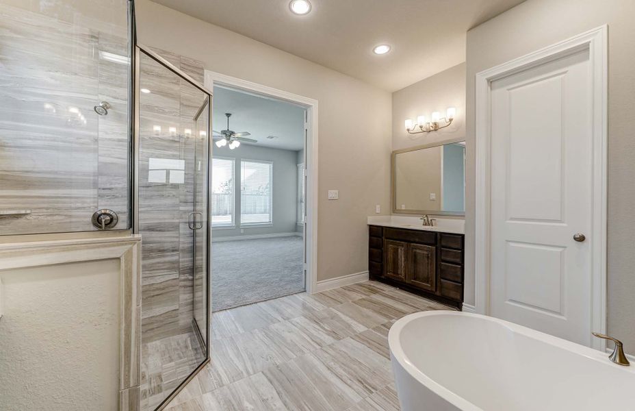 Representative furnished interior of a home built from the 3798 by Ravenna Homes in The Woodlands Hills 65′, Willis (Image 18).