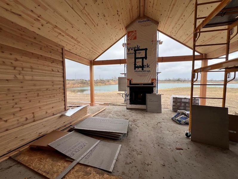 Cedar backporch with woodburning fireplace.