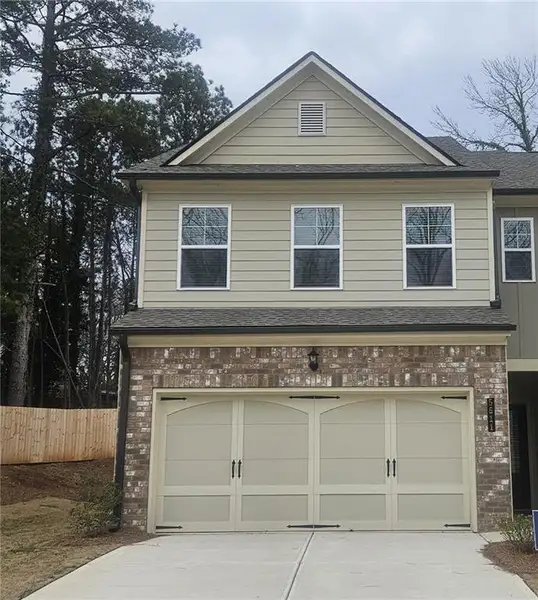 Front exterior of a new home in Mulberry Summit, Flowery Branch, GA, highlighting curb appeal (Image 1). Front exterior of a new home in Mulberry Summit, Flowery Branch, GA, highlighting curb appeal (Image 1).
