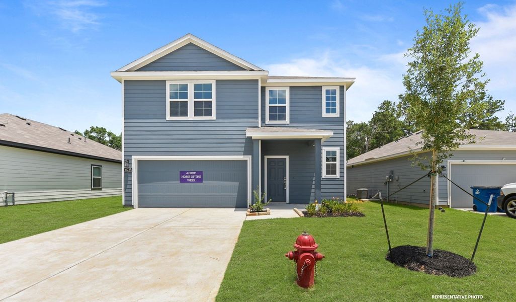 A house with a red fire hydrant in front of it. A house with a red fire hydrant in front of it.