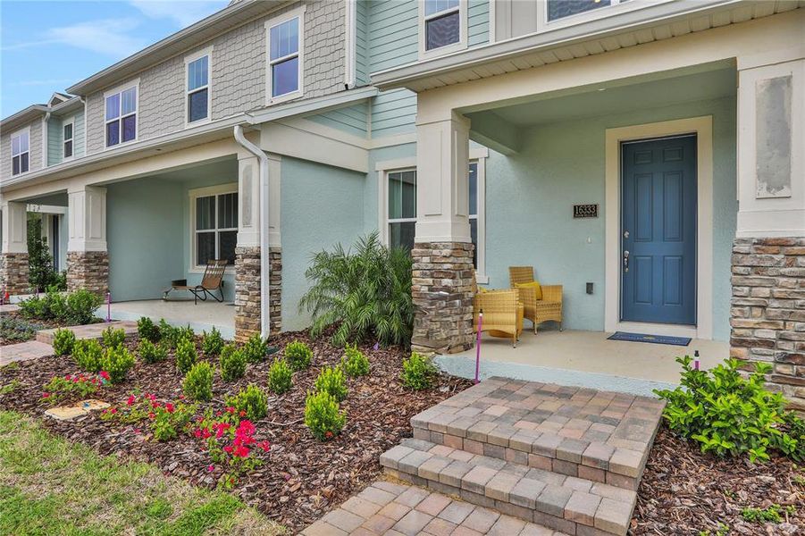 Exterior details and patio area of a home in Serenade at Ovation, Winter Garden (Image 3).