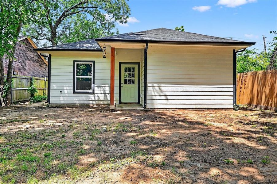 View of front of house with a fenced backyard and roof with shingles View of front of house with a fenced backyard and roof with shingles