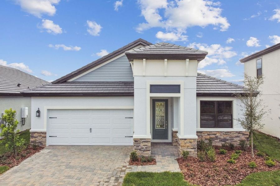 Representative exterior photo of a completed home built from the Solana II by William Ryan Homes in Myers Estates, Seffner, FL (Image 14).
