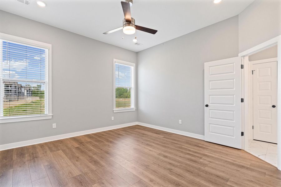 Unfurnished room with a ceiling fan, light wood-style flooring, and recessed lighting