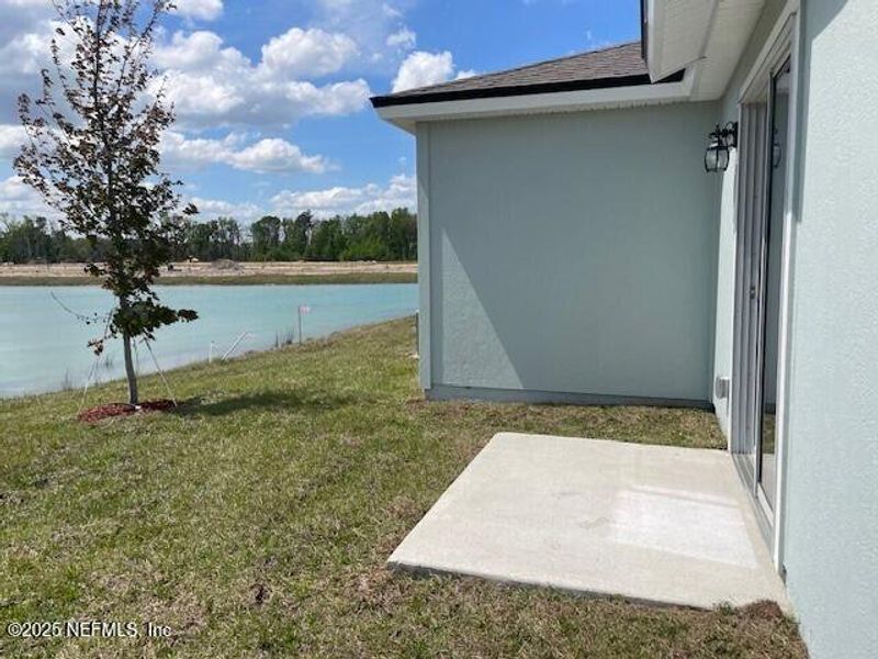 Front exterior of a new home in The Arbors, Jacksonville, FL, highlighting curb appeal (Image 23).