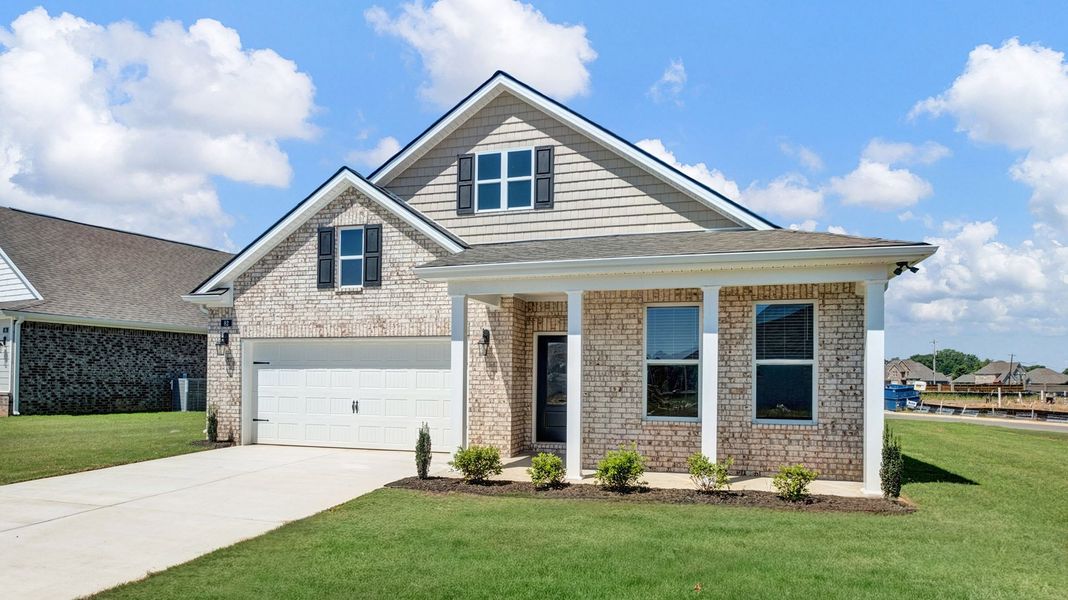 Front exterior of a new home in The Orchard, Millington, TN, highlighting curb appeal (Image 2).