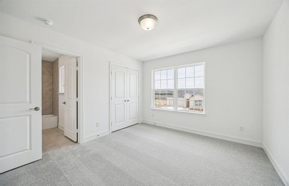 Roomy secondary bedroom with extensive closet storage *Real home pictured Roomy secondary bedroom with extensive closet storage *Real home pictured