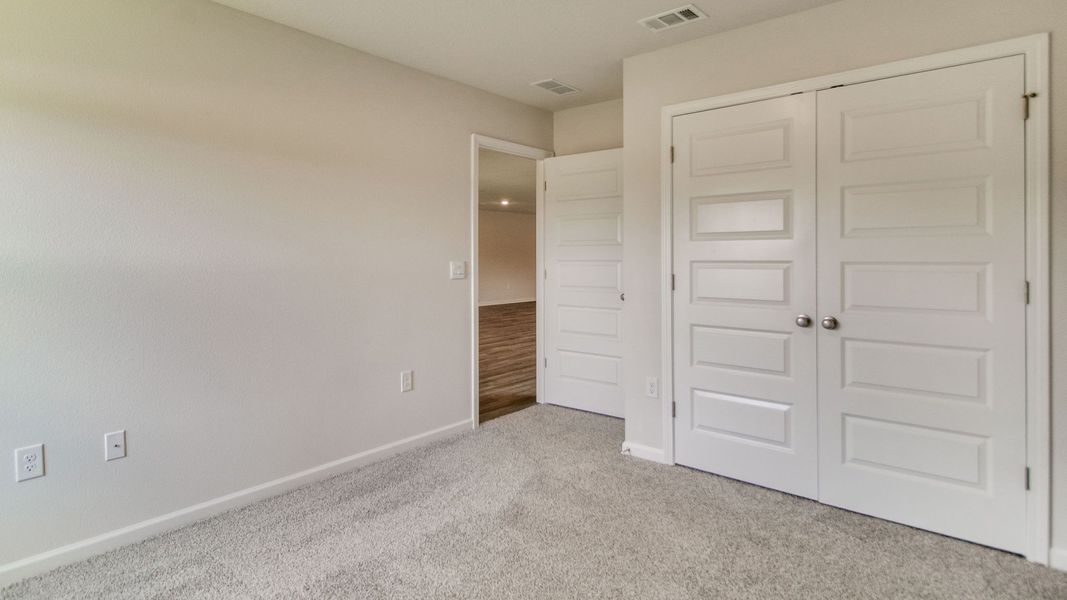 Spacious, unfurnished interior of a new home in The Enclave at Bar W Ranch, Baker (Image 26).