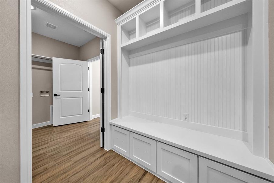 Mudroom with light wood-style flooring Mudroom with light wood-style flooring