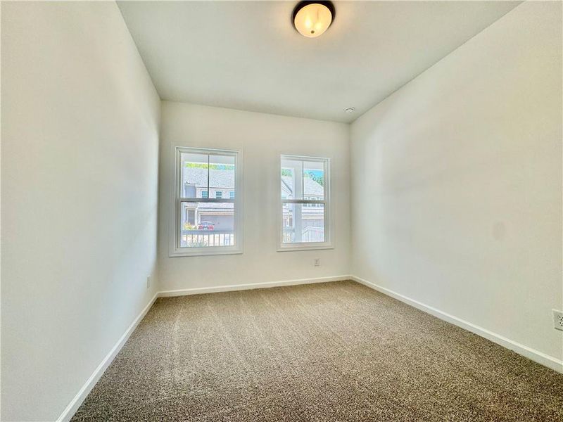 Spacious, unfurnished interior of a new home in Eastlyn Crossing, Flowery Branch (Image 29).