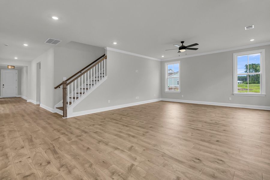 Spacious, unfurnished interior of a new home in Tidewater at Lakes of Cane Bay, Summerville (Image 13).