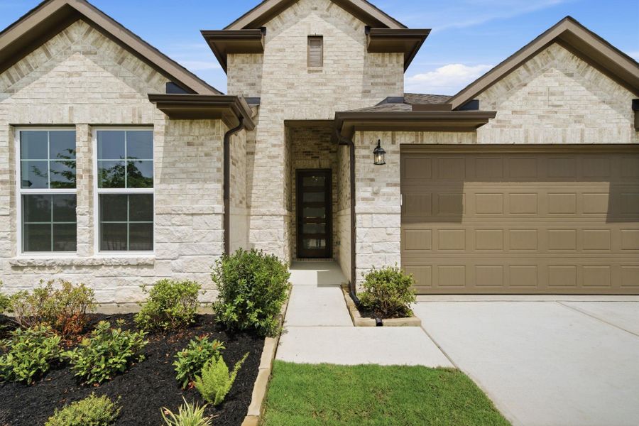 Front exterior of a new home in The Highlands, Porter, TX, highlighting curb appeal (Image 26).