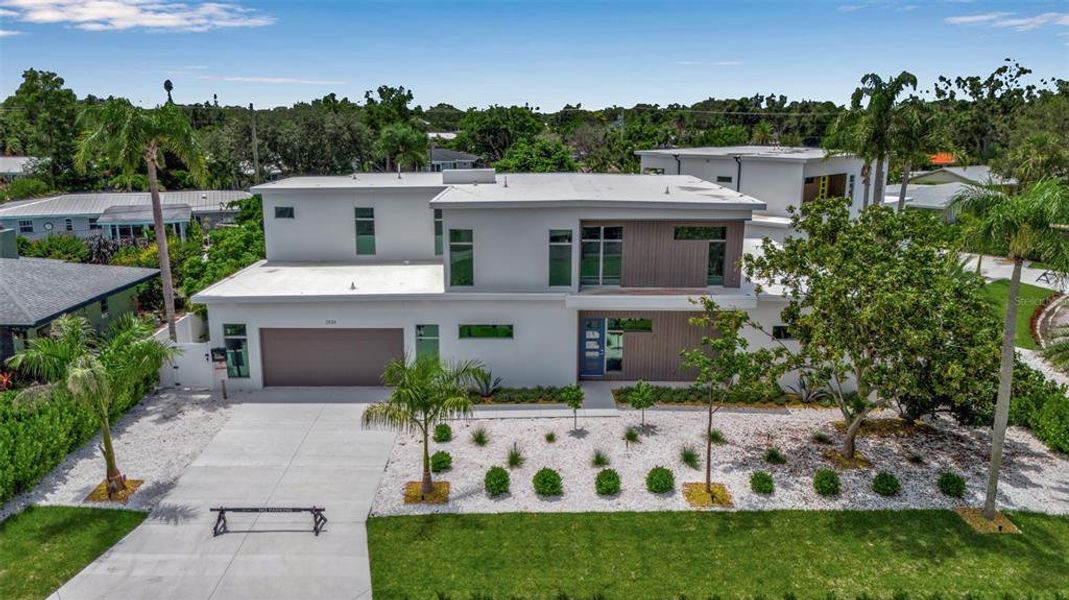 Front exterior of a new home in , Sarasota, FL, highlighting curb appeal (Image 31).