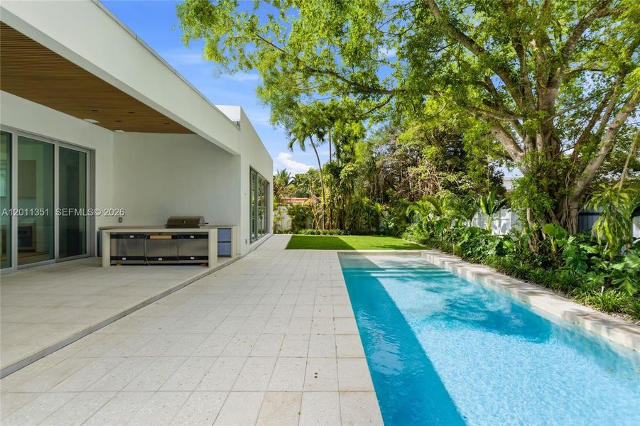 Exterior details and patio area of a home in , Miami Springs (Image 6).