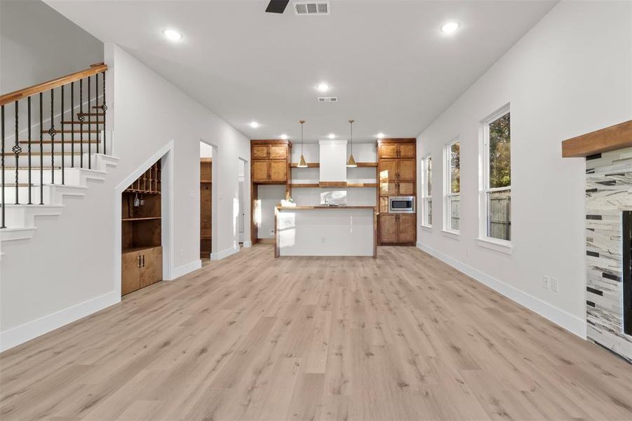 Unfurnished living room featuring light hardwood / wood-style floors