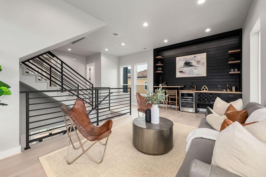 Second-floor living area with wet bar — ideal for entertaining or a private lounge.