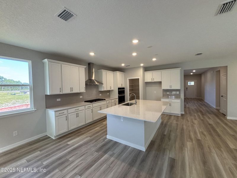Furnished interior view inside a new home in The Cypress Series at Reserve East, Flagler Beach (Image 8).