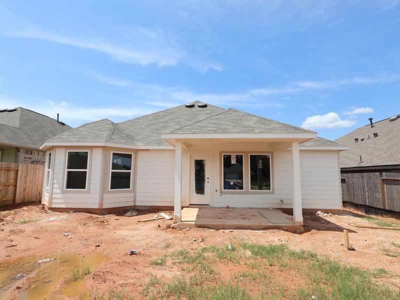Front exterior of a new home in Magnolia Ridge, Magnolia, TX, highlighting curb appeal (Image 13).
