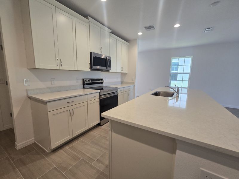 Furnished interior view inside a new home in Sky Lakes Estates, St. Cloud (Image 3).