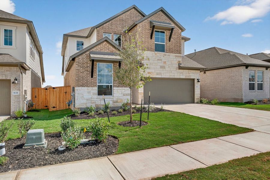 Exterior details and patio area of a home in Arbor Collection at Lariat, Liberty Hill (Image 2). Exterior details and patio area of a home in Arbor Collection at Lariat, Liberty Hill (Image 2).