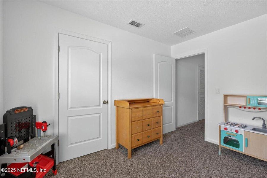 Furnished interior view inside a new home in River Glen Express, Yulee (Image 39).