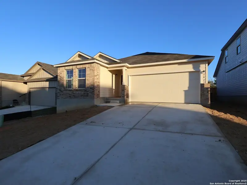 Front exterior of a new home in Agave, San Antonio, TX, highlighting curb appeal (Image 2). Front exterior of a new home in Agave, San Antonio, TX, highlighting curb appeal (Image 2).