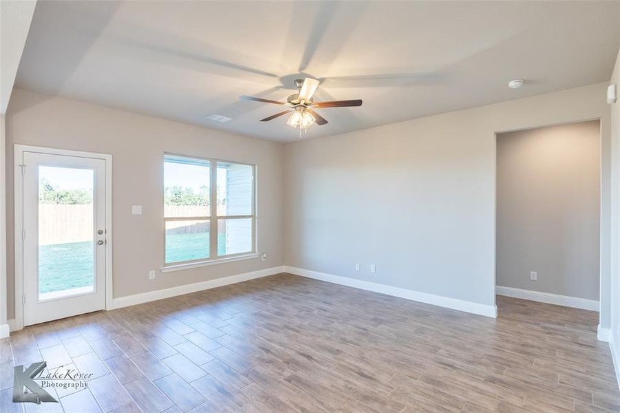 Washroom featuring hookup for an electric dryer, hookup for a washing machine, recessed lighting, and cabinet space