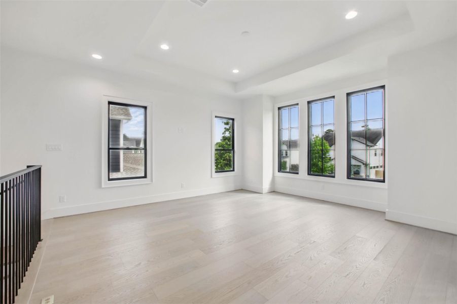 Sample of builder's previous construction. This home will have an upstairs game room at the stair landing. This new construction will have a similar layout as pictured here.