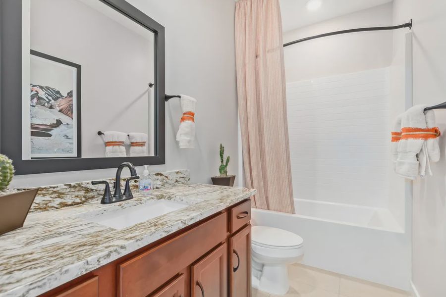 Representative furnished interior of a home built from the 1257 by Elliott Homes in Camilo at Santana, Yuma (Image 13).