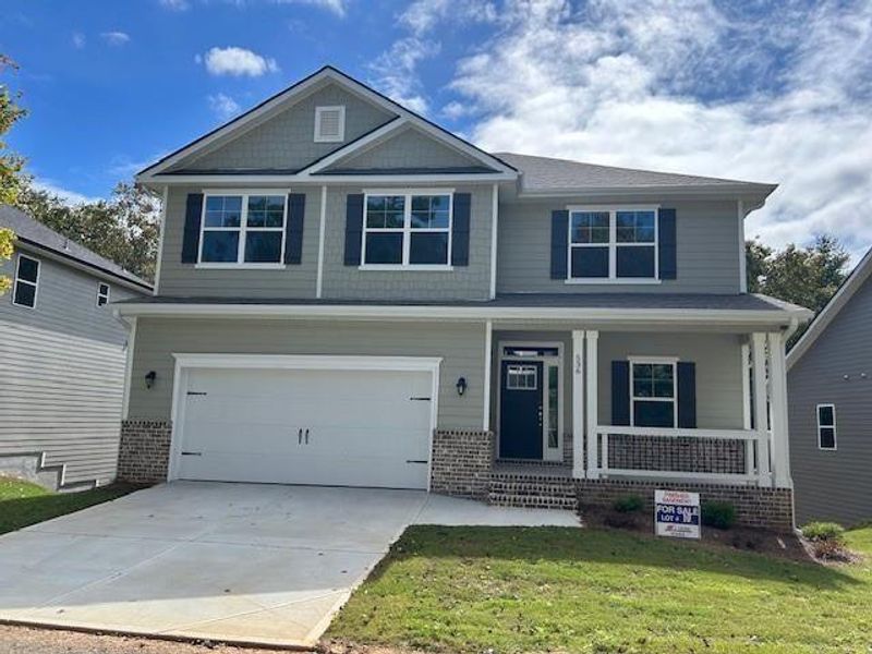 Front exterior of a new home in Habersham Meadows, Demorest, GA, highlighting curb appeal (Image 1).