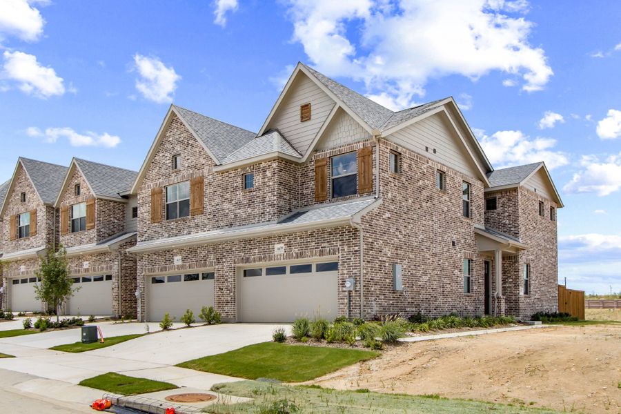 Front exterior of a new home in Wildridge, Oak Point, TX, highlighting curb appeal (Image 1). Front exterior of a new home in Wildridge, Oak Point, TX, highlighting curb appeal (Image 1).