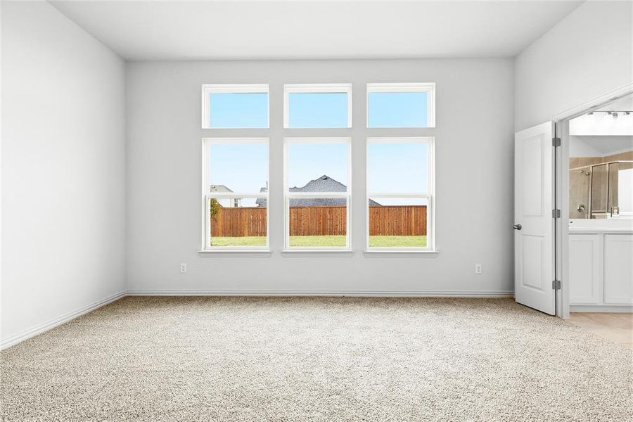 Unfurnished room featuring light colored carpet and baseboards Unfurnished room featuring light colored carpet and baseboards