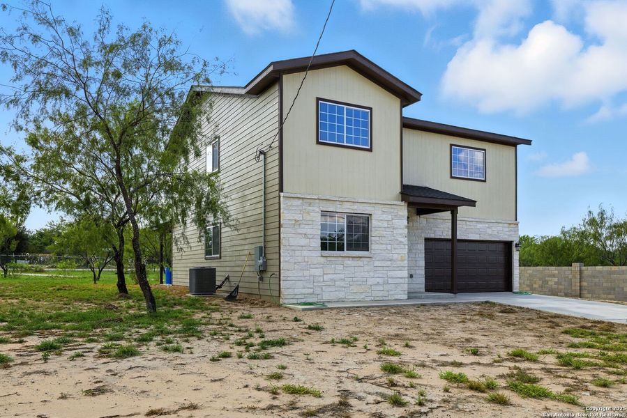 Front exterior of a new home in , Lytle, TX, highlighting curb appeal (Image 21). Front exterior of a new home in , Lytle, TX, highlighting curb appeal (Image 21).