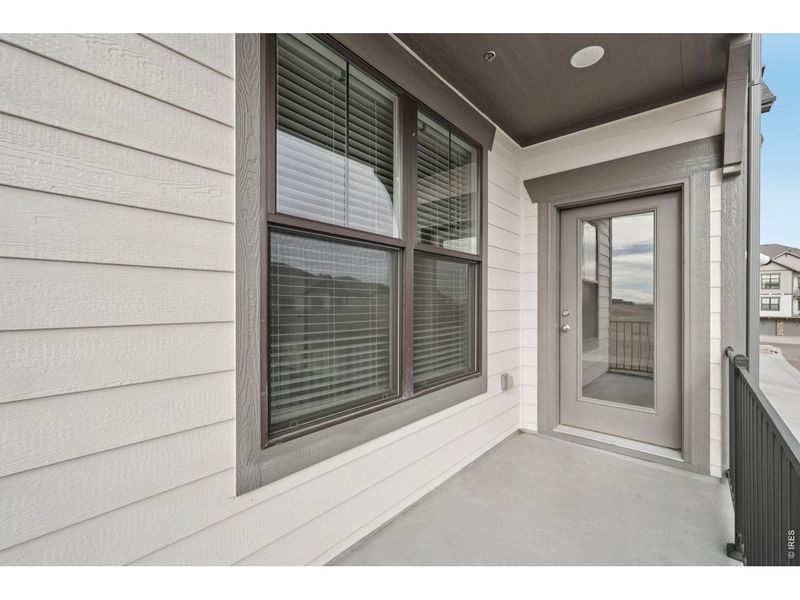 Exterior details and patio area of a home in Highlands at Fox Hill - The Flats, Longmont (Image 16).