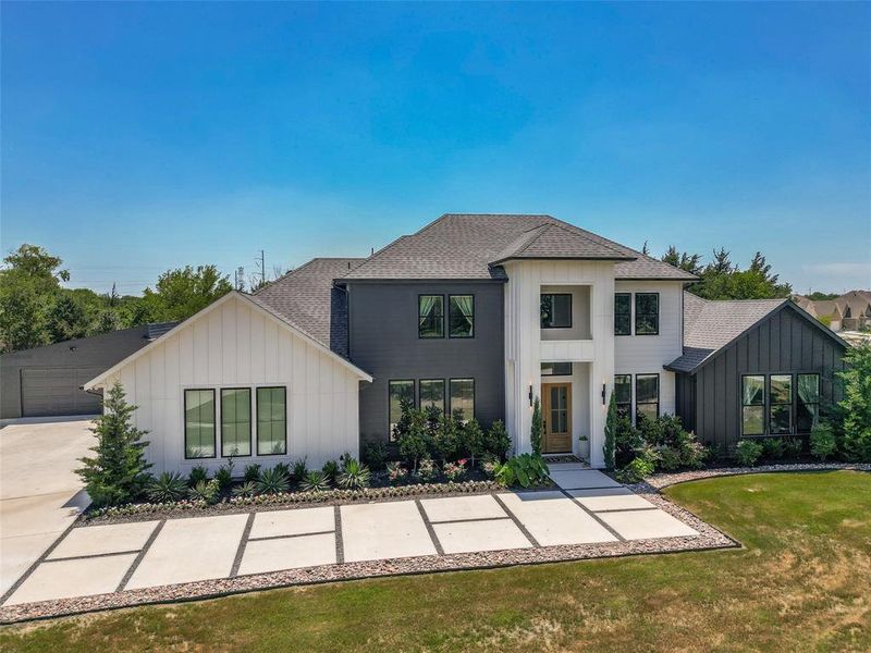 Front exterior of a new home in , Garland, TX, highlighting curb appeal (Image 2). Front exterior of a new home in , Garland, TX, highlighting curb appeal (Image 2).