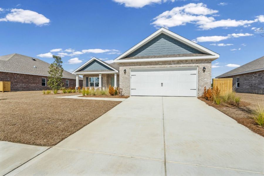 Front exterior of a new home in Natureview, Freeport, FL, highlighting curb appeal (Image 23).