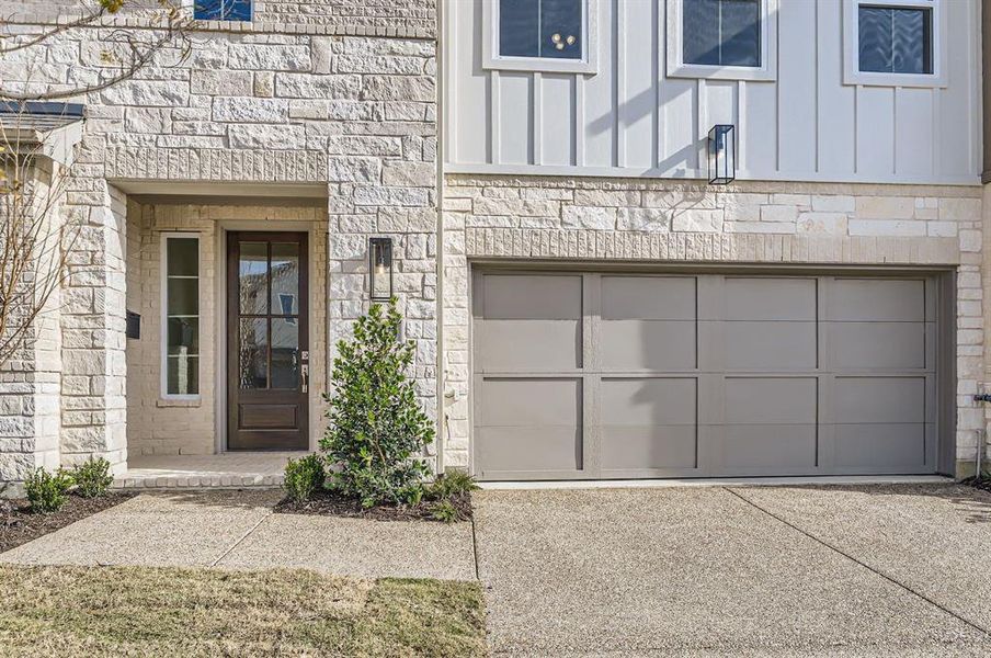 Property entrance featuring a garage