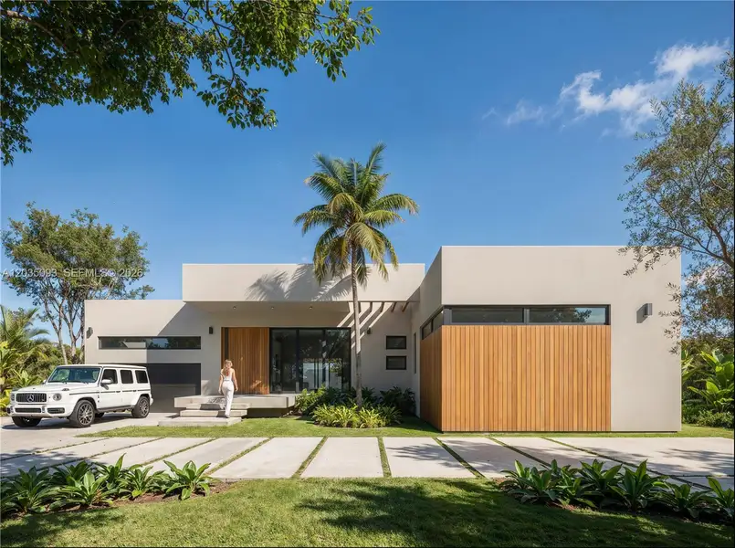 Front exterior of a new home in , Pinecrest, FL, highlighting curb appeal (Image 1). Front exterior of a new home in , Pinecrest, FL, highlighting curb appeal (Image 1).