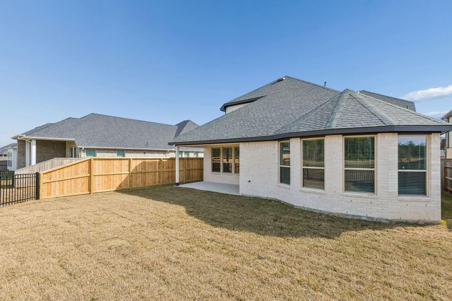 Exterior details and patio area of a home in Mavera, Conroe (Image 12). Exterior details and patio area of a home in Mavera, Conroe (Image 12).